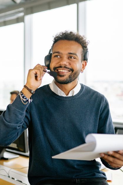 A person smiling while on a call